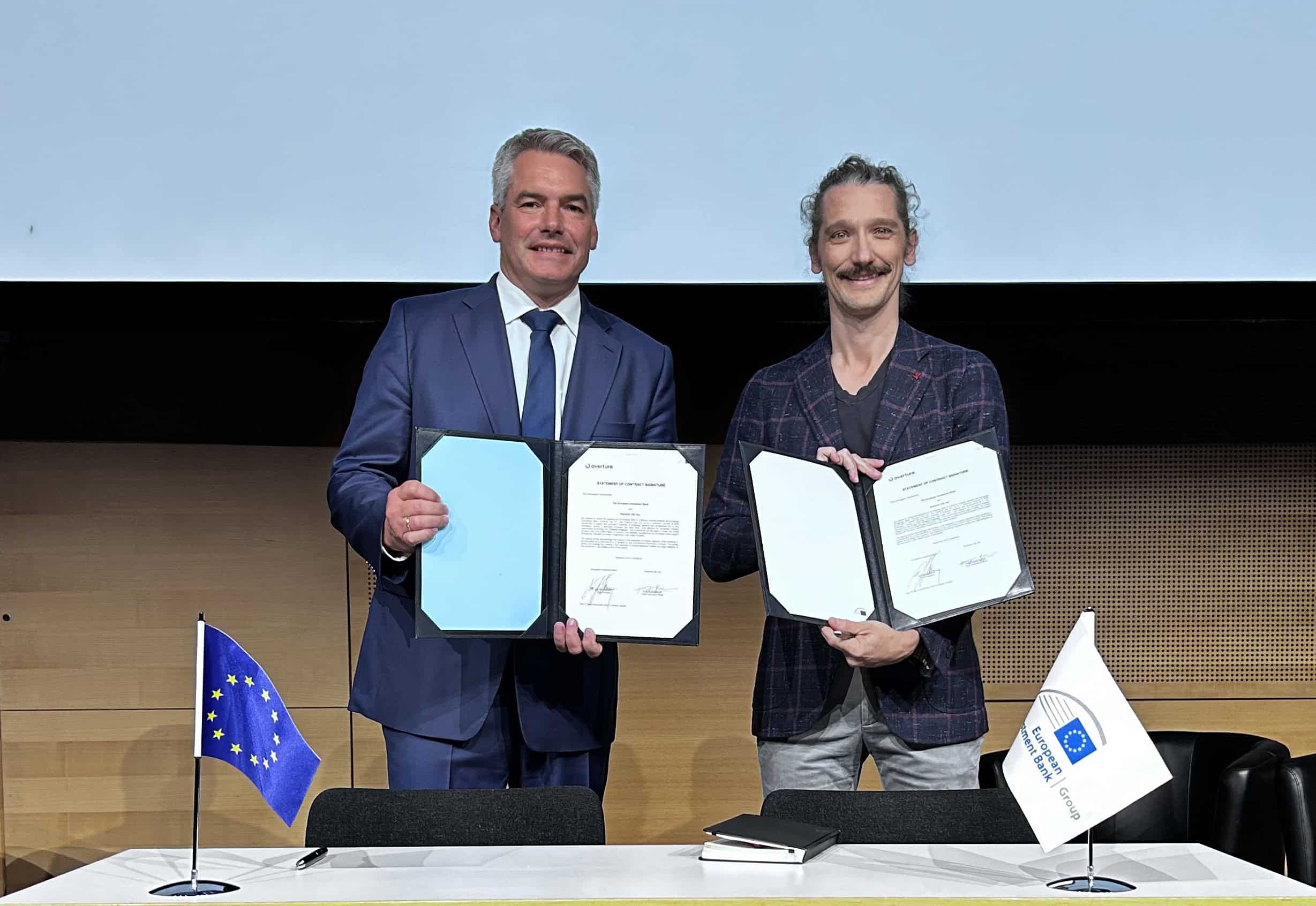 EIB Overture Life signing EIB vice president Karl Nehammer & Hans Gangeskar Overture Life CEO